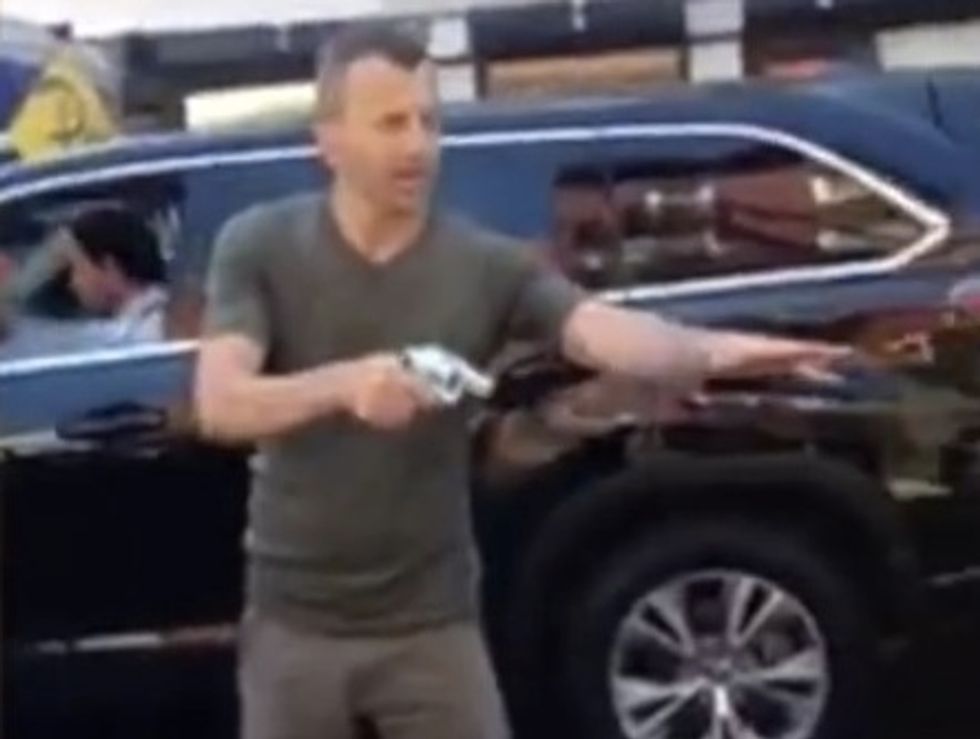 Motorist Caught on Video Apparently Pulling Gun During Street Confrontation. But What He Does During Working Hours Is Bigger News.