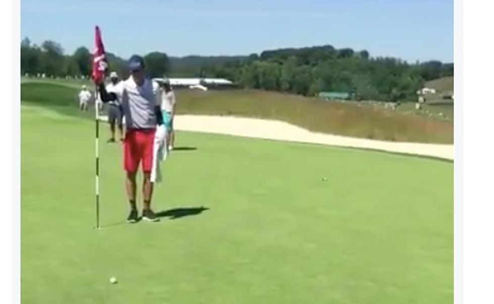 Chip, flip, catch, toss...It's in the hole! Watch golfer Bubba Watson's impressive trick shot