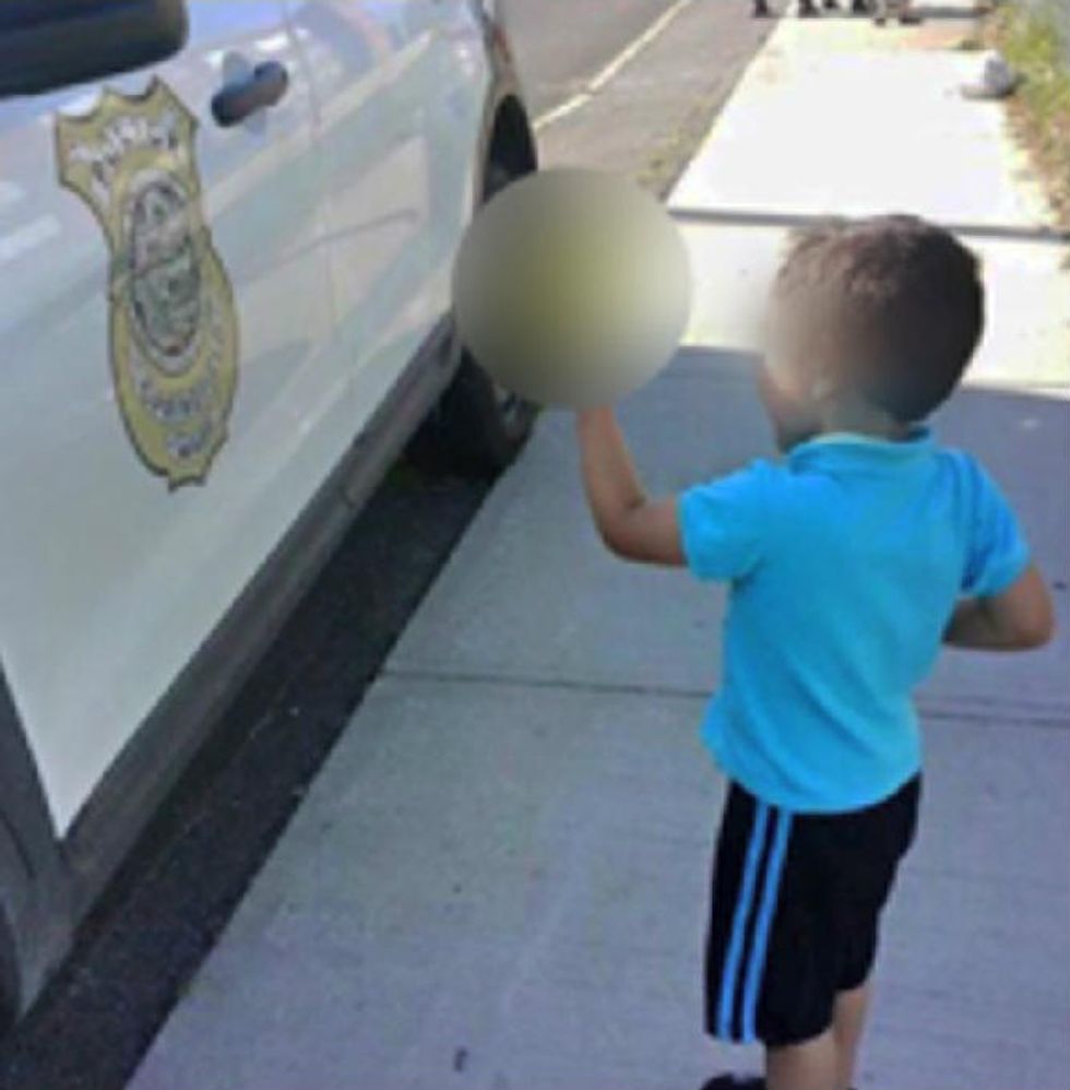 You Shouldn’t Be Surprised by Officer’s Response to Viral Photo of Young Boy Flipping Off Cop Car