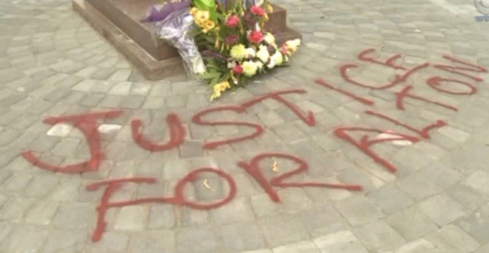 Police Memorial Vandalized With the Phrase 'Justice for Alton' Spelled Out in Red Paint