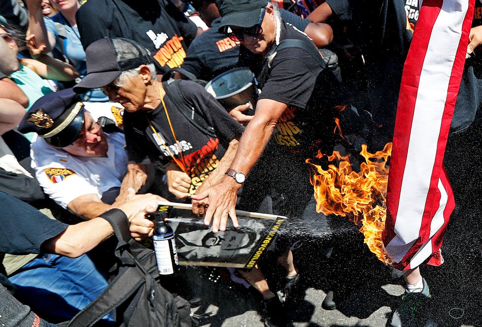 Cop Has Only Four Words to Say to American Flag-Burning RNC Protester: 'You're on Fire, Stupid' (UPDATE: There's Video)