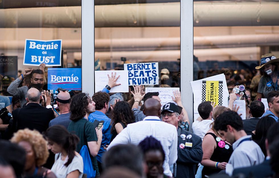 Sanders Supporters Burn Israeli Flag, Stage Sit-In at Media Tent to Protest ‘Rigged System\
