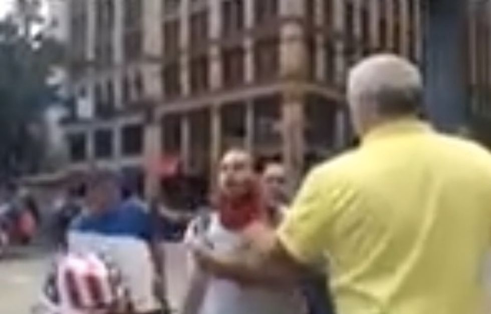 Check Out What Happens After 68-Year-Old Trump Supporter Stops 23-Year-Old From Burning American Flag