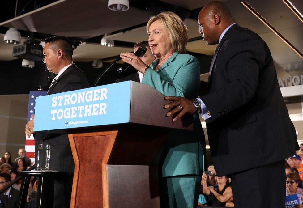 Clinton Surrounded by Secret Service When Activists Try Jumping Rally Stage. She Then Uses Moment to Rip Trump.