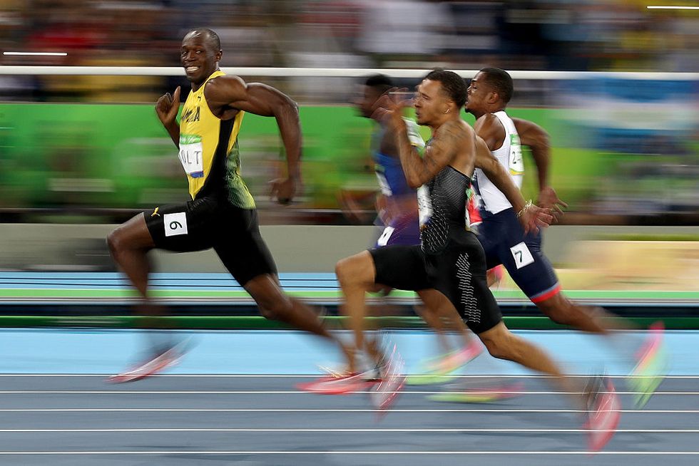 Epic Olympics Photo Shows Usain Bolt Posing for the Camera Mid-Race