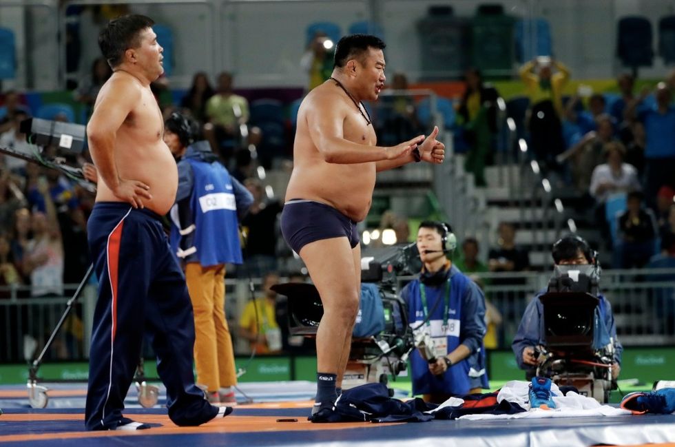 Mongolian Coaches Protest Their Olympic Wrestler's Gut-Wrenching Loss by...Stripping Off Their Clothes
