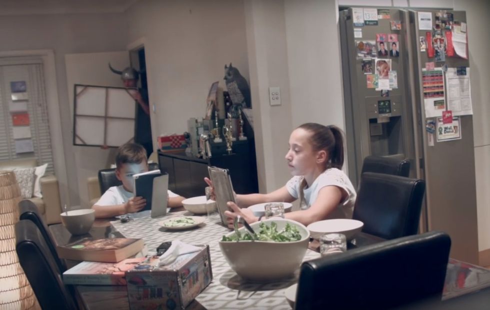 Video: Tech-Distracted Kids So Deep Into Devices They Fail to Notice New 'Parents' Sitting at Dinner Table