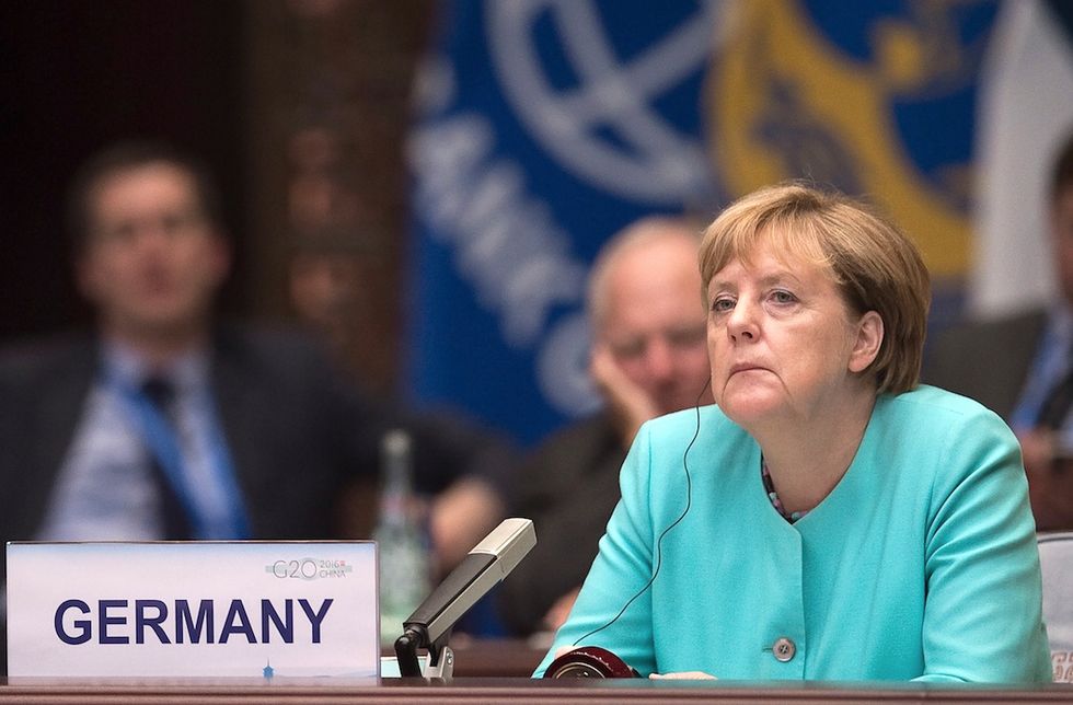 German Chancellor Merkel Stands By Refugee Policy After Her Party's Election Defeat