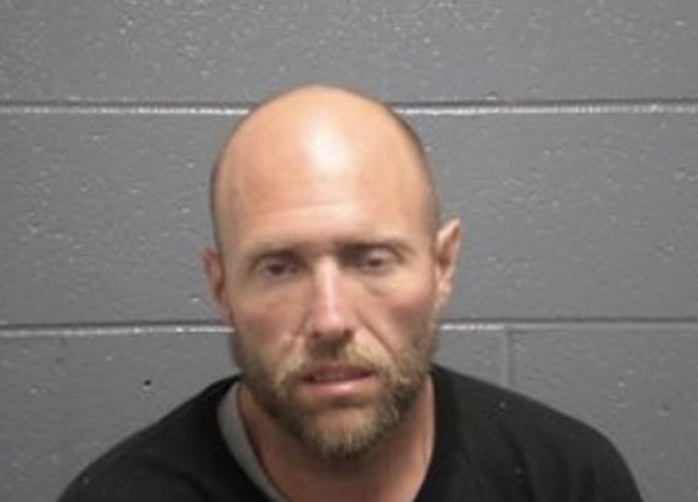 Police Catch Masked Man in Driver's Seat of Broken-Into Car While He's Hard at Work Catching Something Else