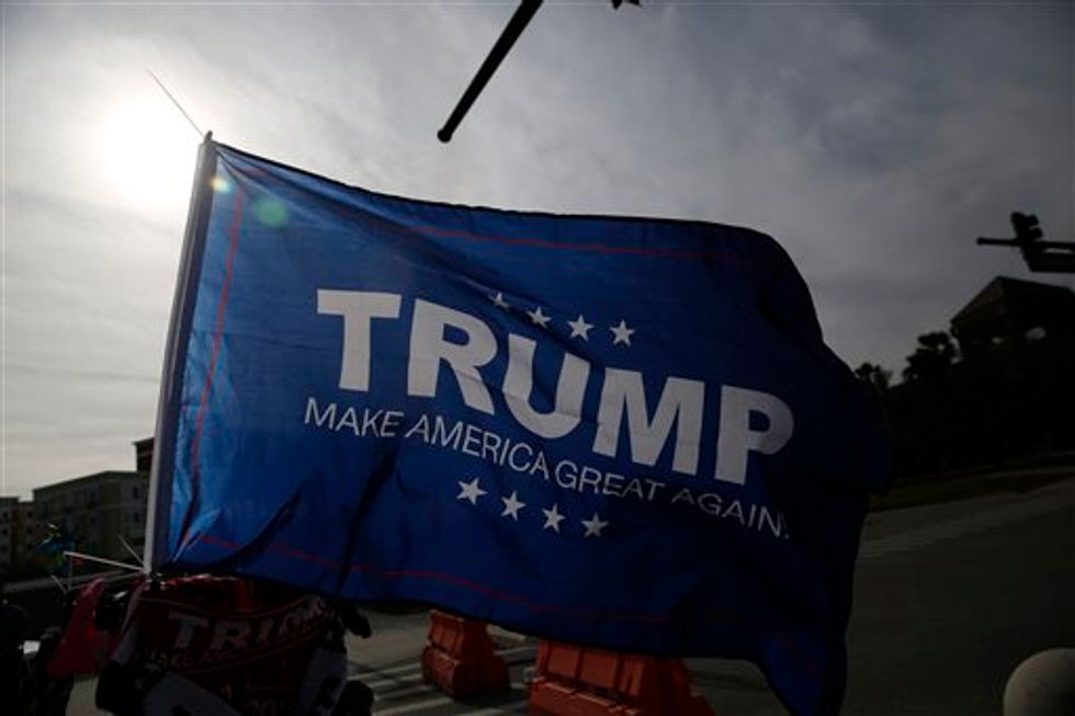 Alabama high school apologizes for 'disrespectful' Trump banner at football game