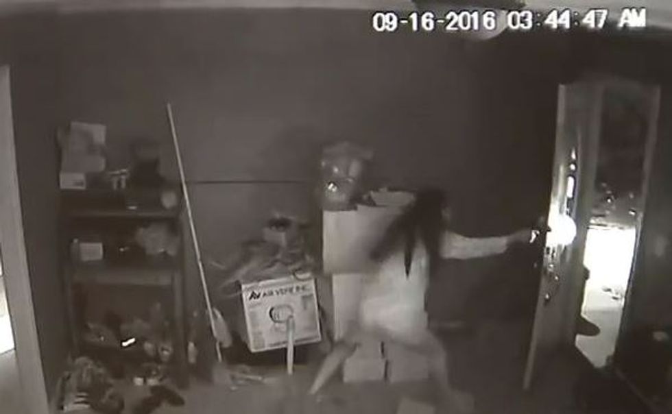 Gun-toting woman rushes from bedroom, fires at terrified home invaders — and it's all on surveillance video