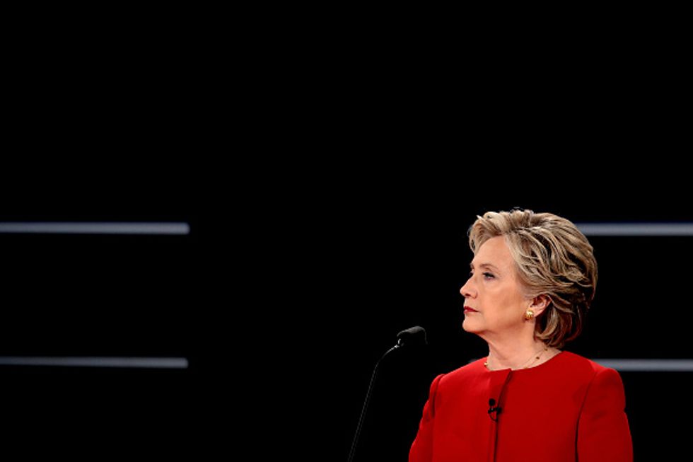 Clinton argues for stricter background checks as 'police are outgunned' in certain communities
