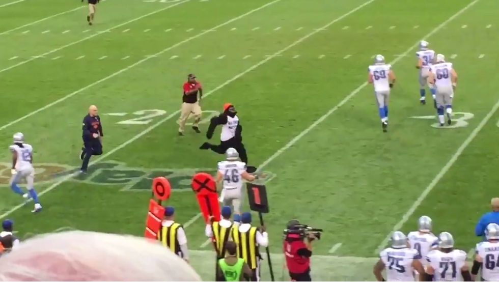 Sports writers blast 'racist' man in gorilla suit and 'All Lives Matter' shirt who ran on field during NFL game. Then cops pull off his mask.
