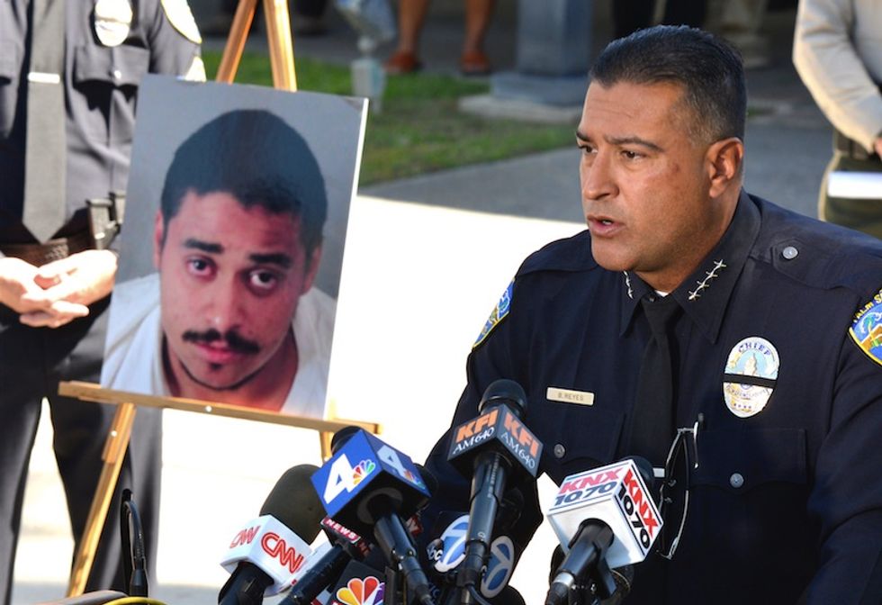 Suspect in officers' slaying wanted to shoot police, his father reportedly says
