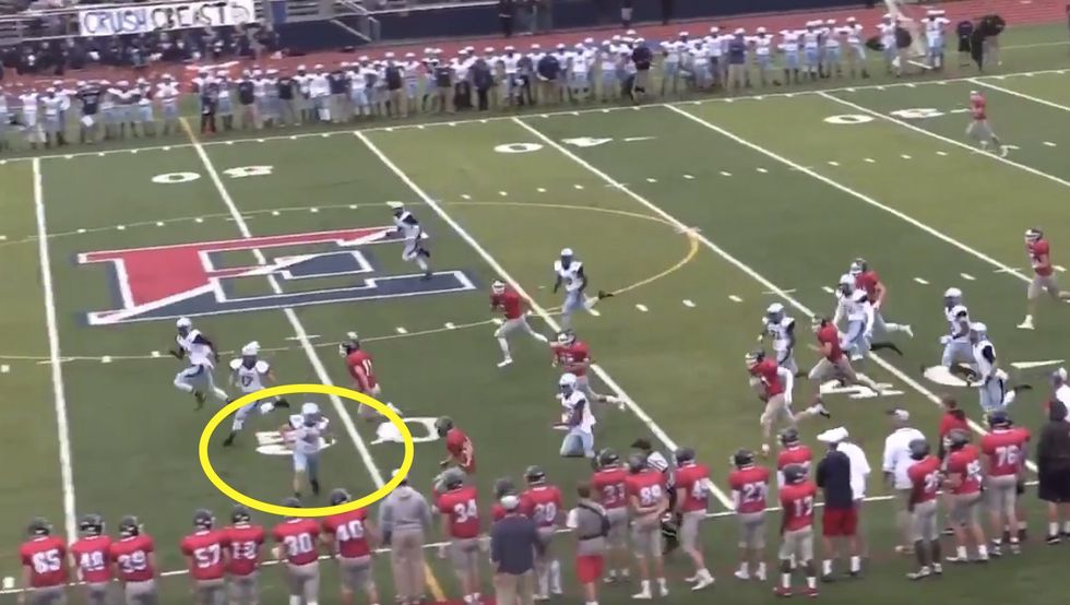 Female H.S. football kicker goes after kick returner — who likely didn't figure his sideline sprint would end so abruptly