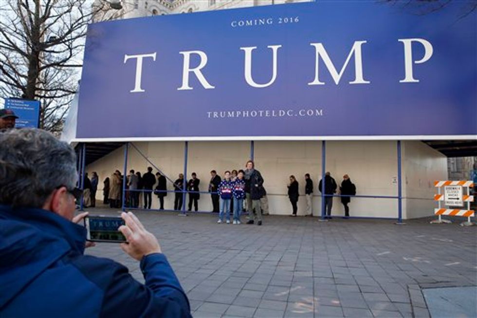 Veteran's daughter unloads on protesters holding defaced American flag outside Trump D.C. hotel ribbon-cutting
