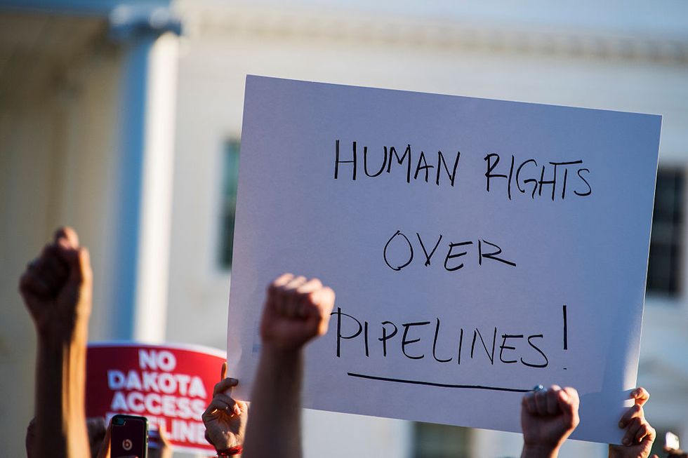 Following tense standoff, North Dakota pipeline protesters staying near camp