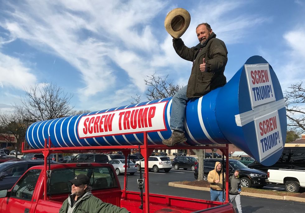 Watch: Clinton supporter brings graphic message to Trump Pennsylvania campaign event