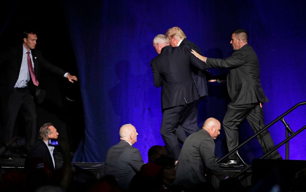 Donald Trump rushed off stage by Secret Service after man in crowd yells 'gun