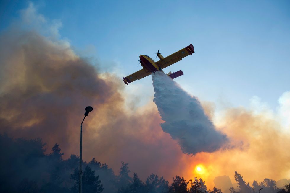 Terrorists blamed for wildfires raging through Israel