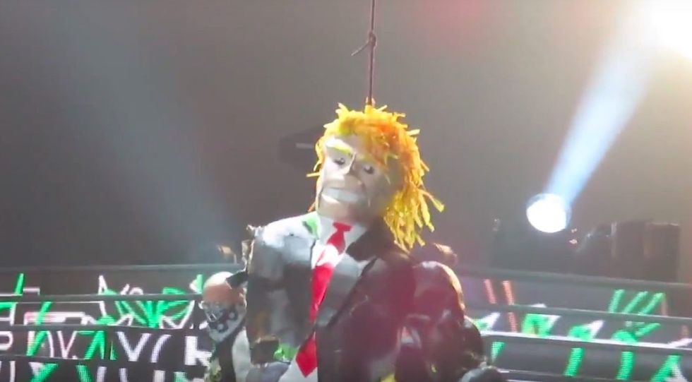 Guns N' Roses invited fans onstage to beat a 'yuge' Trump piñata during concert in Mexico City