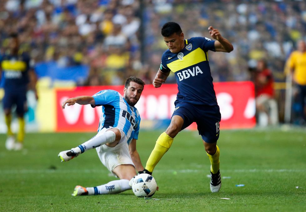 Watch: Argentina soccer fans take the field and punch referees