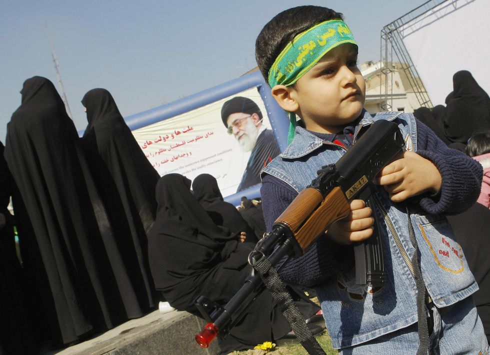 Iran's new theme park allows children to fire at the American flag