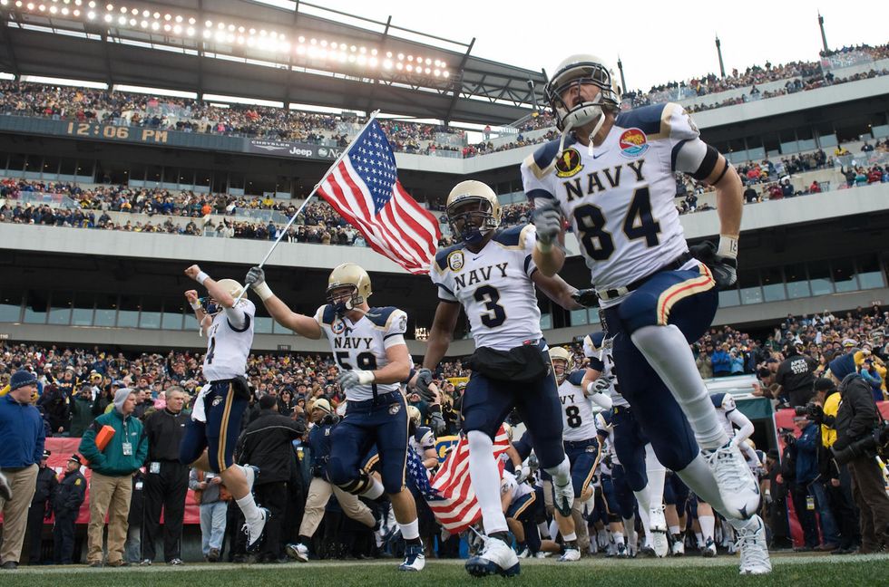 Protesters gather in Baltimore as Donald Trump heads to Army-Navy game
