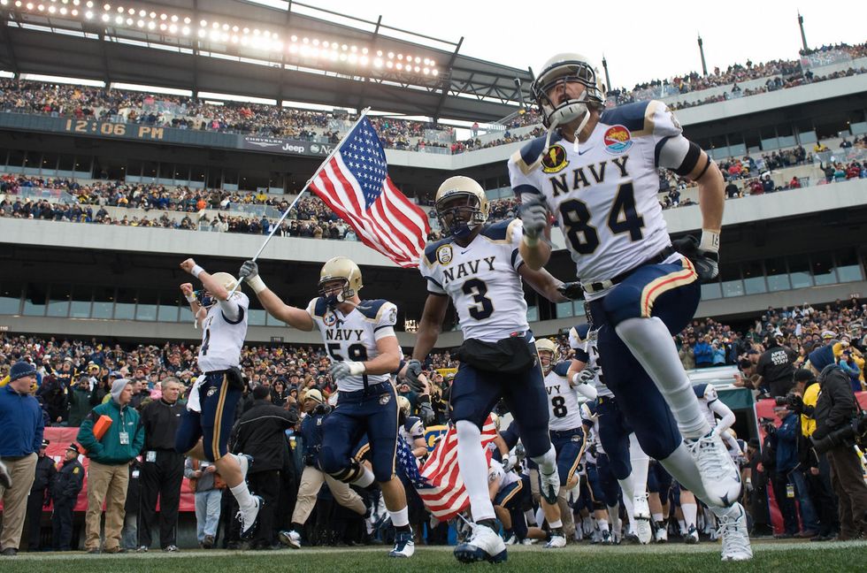 Protesters gather in Baltimore as Donald Trump heads to Army-Navy game