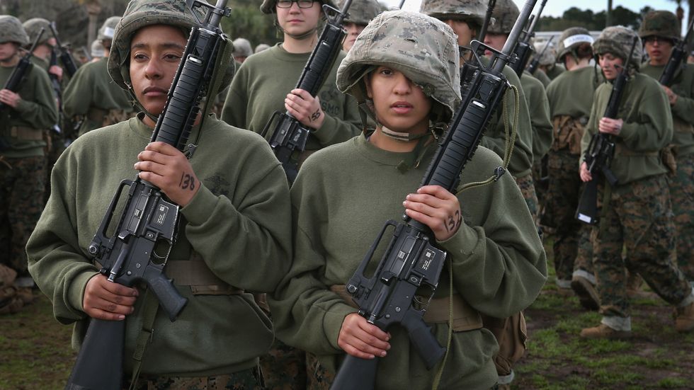Should women serve in combat roles and register for the draft?