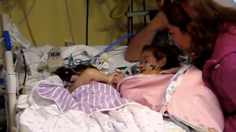 Watch the moment formerly conjoined twins meet for the first time since their surgery