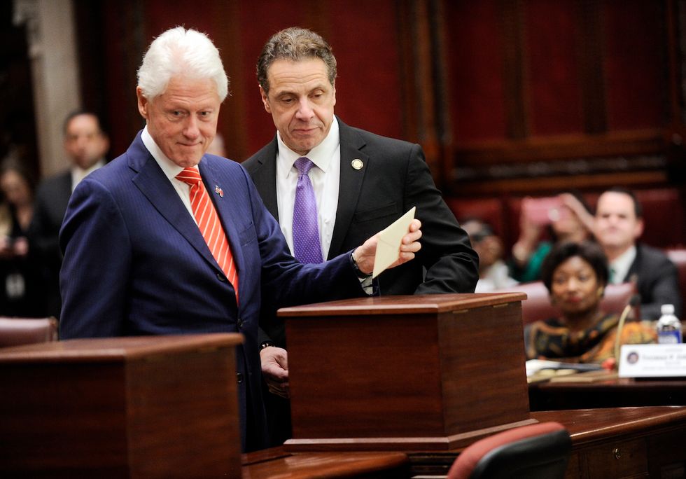 Bill Clinton casts an electoral vote for his wife on the anniversary of his own impeachment