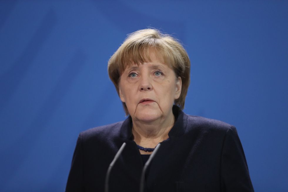 Angela Merkel says it would be 'hard for us all to bear' if Berlin attacker were a Syrian refugee
