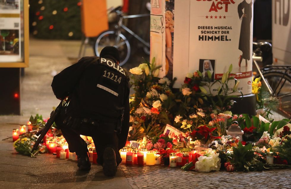 New suspect sought in Berlin Christmas market attack after refugee documents discovered