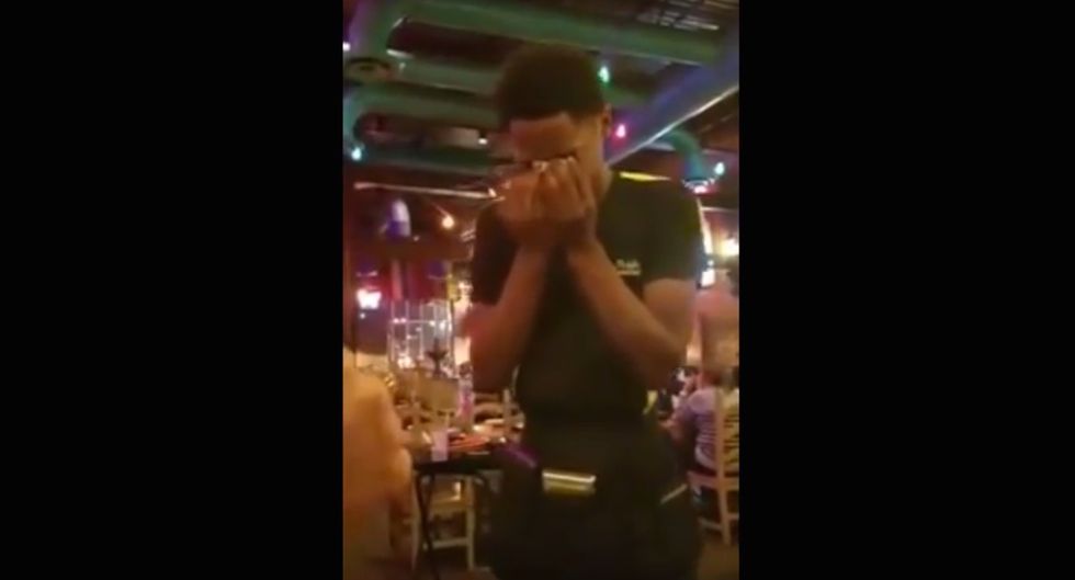 Watch: The Christmas spirit makes a waiter having a bad day break down in tears
