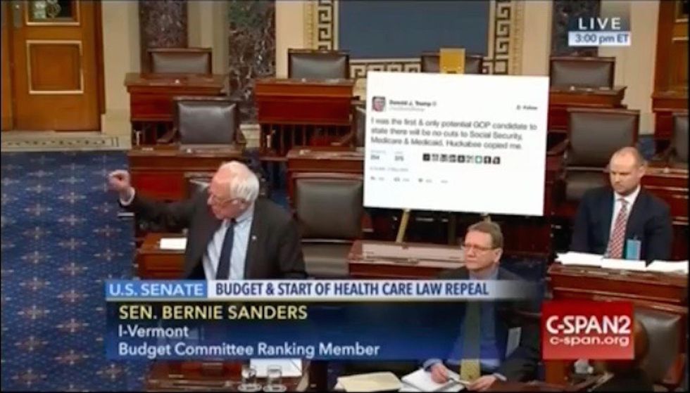 Bernie Sanders prints a Trump tweet on a giant poster and drags it to the Senate floor