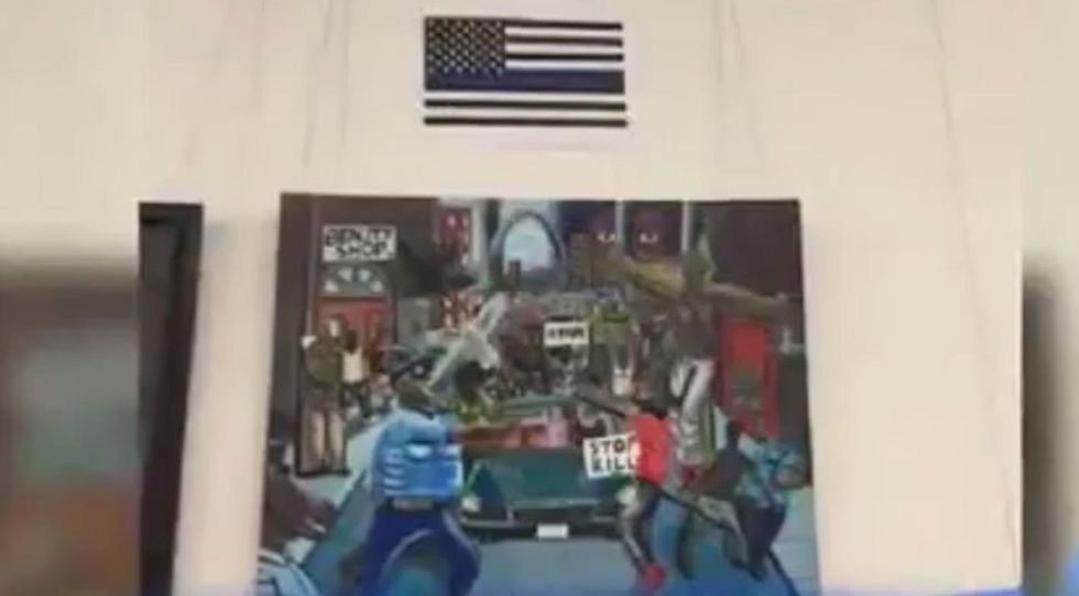 Controversial cops-as-pigs painting on Capitol Hill just got upstaged — by Thin Blue Line flag