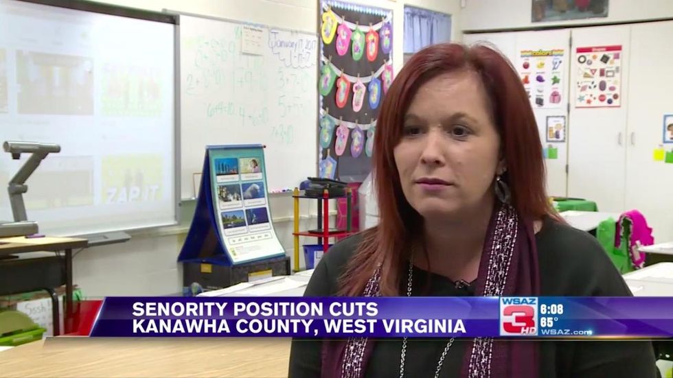 Teachers draw numbers from hat to determine who their school district lays off