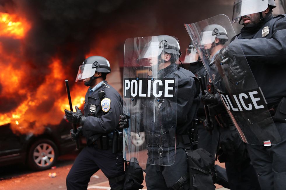 Police arrest more than 200 people as inauguration protests turn into violent riots