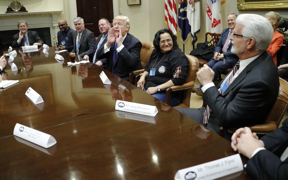 Trump says he's about to cut taxes and regulations 'massively