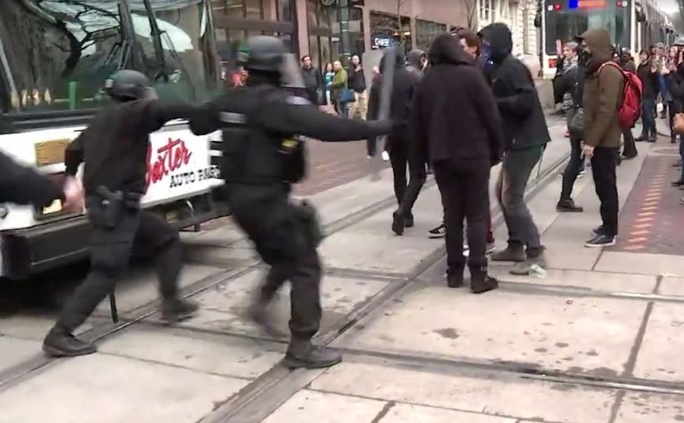 Check out what cops do to protesters blocking city intersection. Crowd reaction is the best part.
