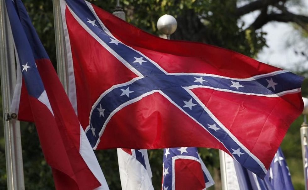 Middle school teacher, 70, slammed for displaying Confederate flag in class 'will not be returning