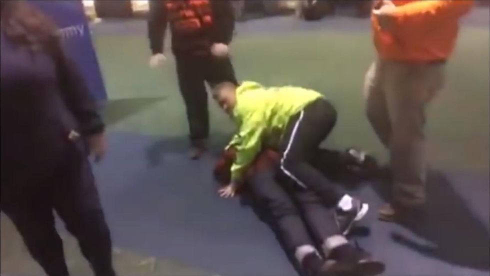 Video: Pro-Trump counter-demonstrator knocked out at airport protest — but there's more to the story