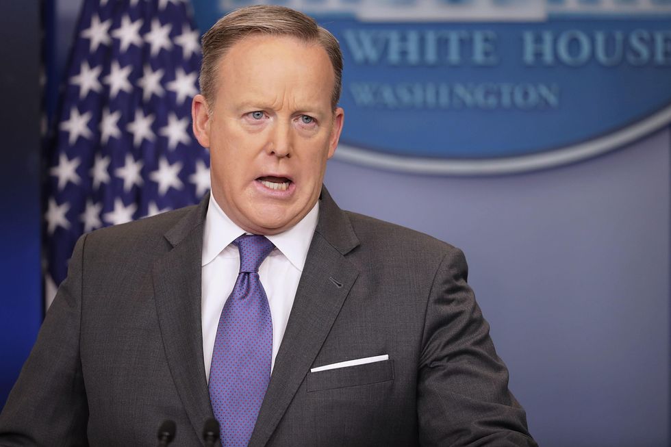 Spicer insists president's executive order 'not a travel ban' — despite Trump saying so