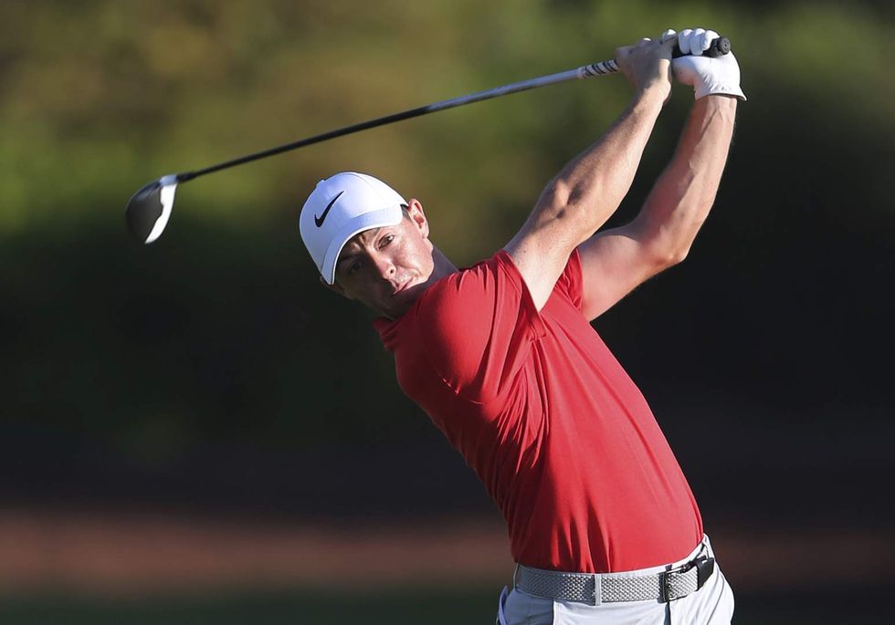 Pro golfer Rory McIlroy faces social media backlash after 'just a round of golf' with Trump