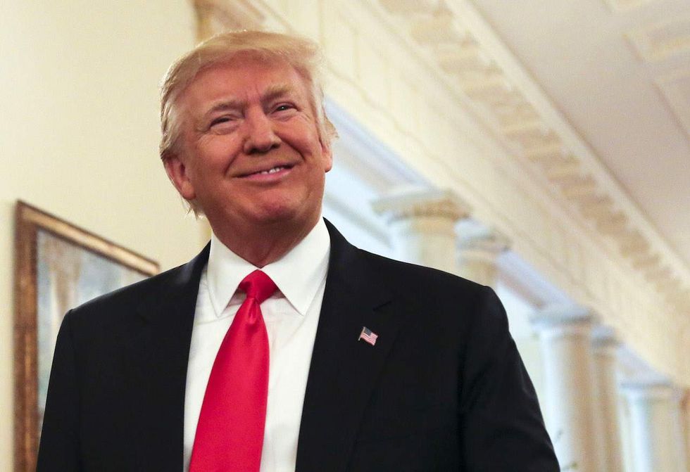 Trump grades the early days of his presidency, and he sounds a lot like Obama