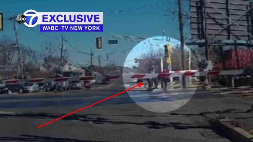 That was close! Video shows heroic rescue of elderly woman from train tracks