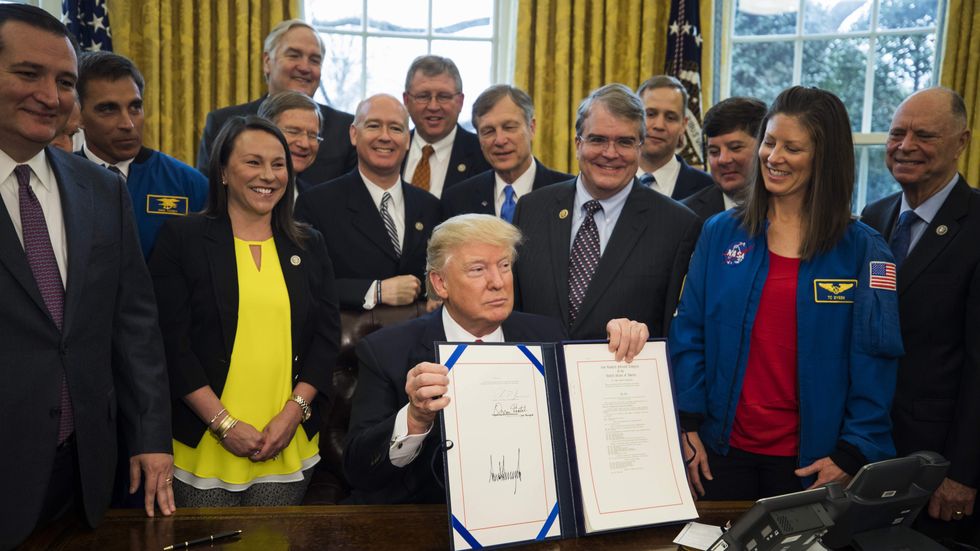Trump signs NASA funding bill, advancing cause of manned missions to Mars