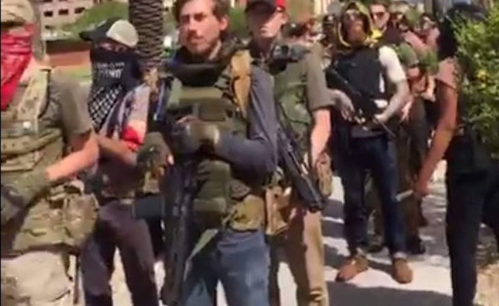 Heavily armed left-wing group tries to intimidate liberal reporter filming them. It doesn't work.