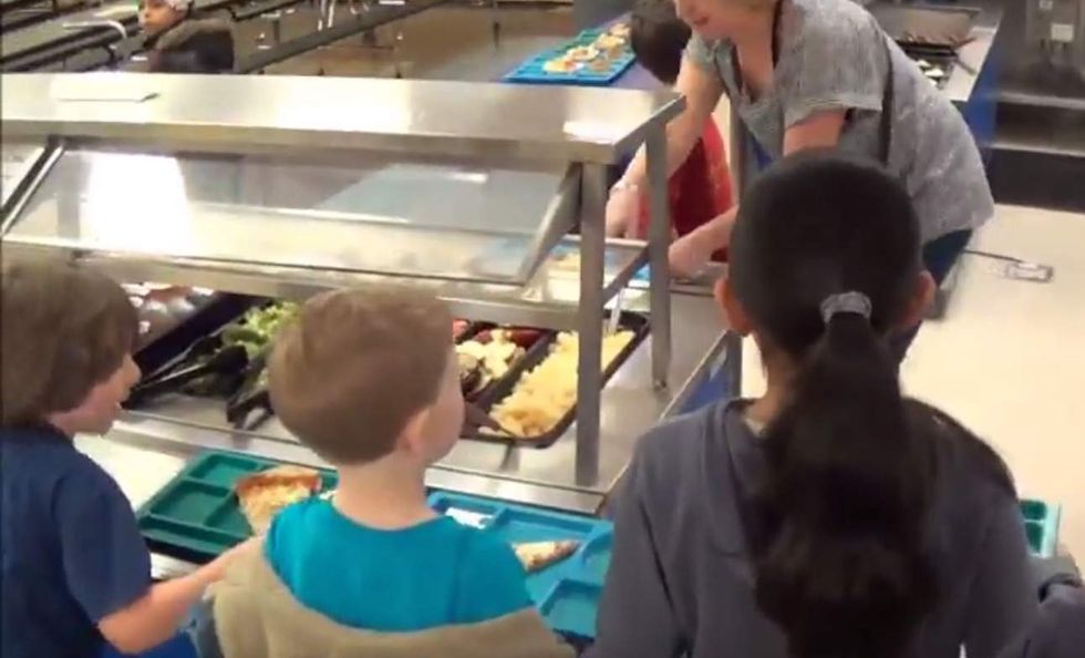 Second-grader short on lunch money comes home with message from cafeteria — stamped on his wrist